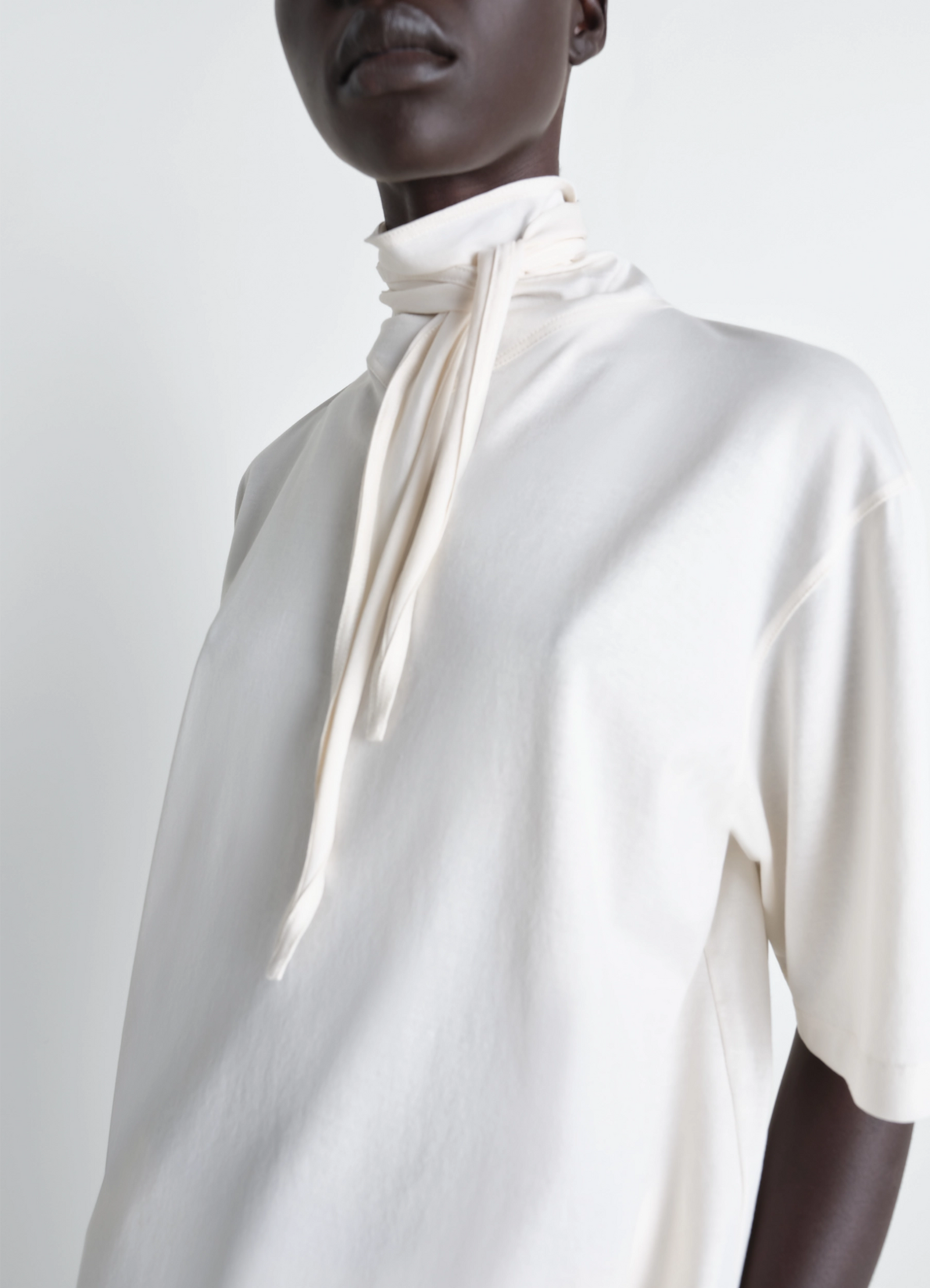 Lemaire t-shirt with foulard in light mercerised cotton jersey, model shot, close-up partial view scarf wrap neck detail