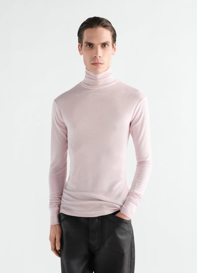 Stand-collar wool and silk jersey top in light pink worn by model front view LEMAIRE