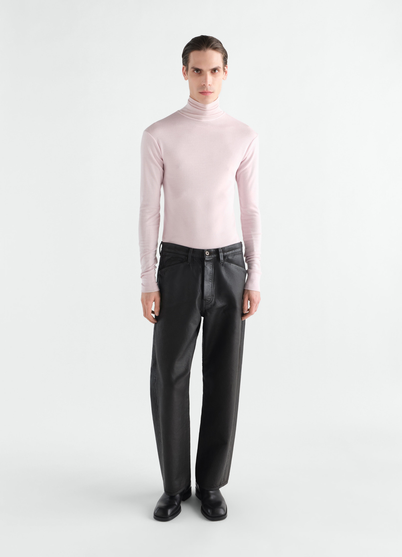 Stand-collar wool and silk jersey top in pale pink by lemaire worn by a model front view