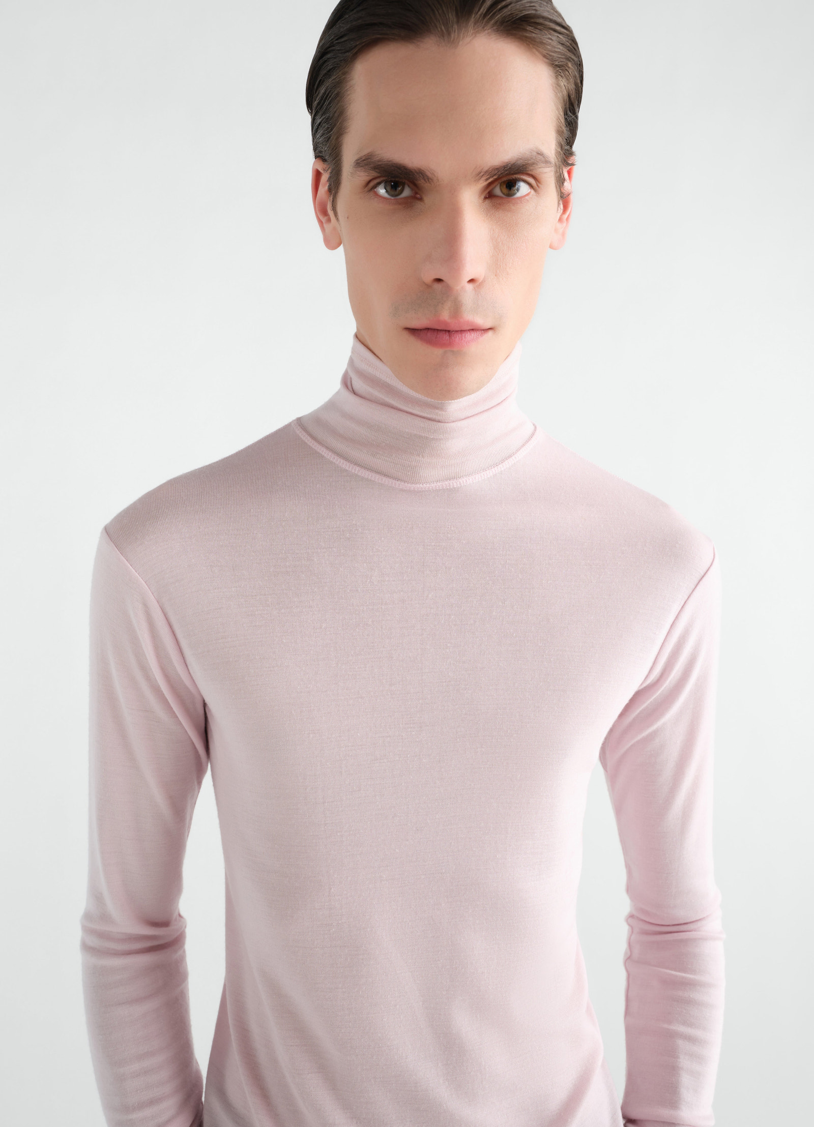 Stand-collar wool and silk jersey top in light pink worn by a model front view lemaire