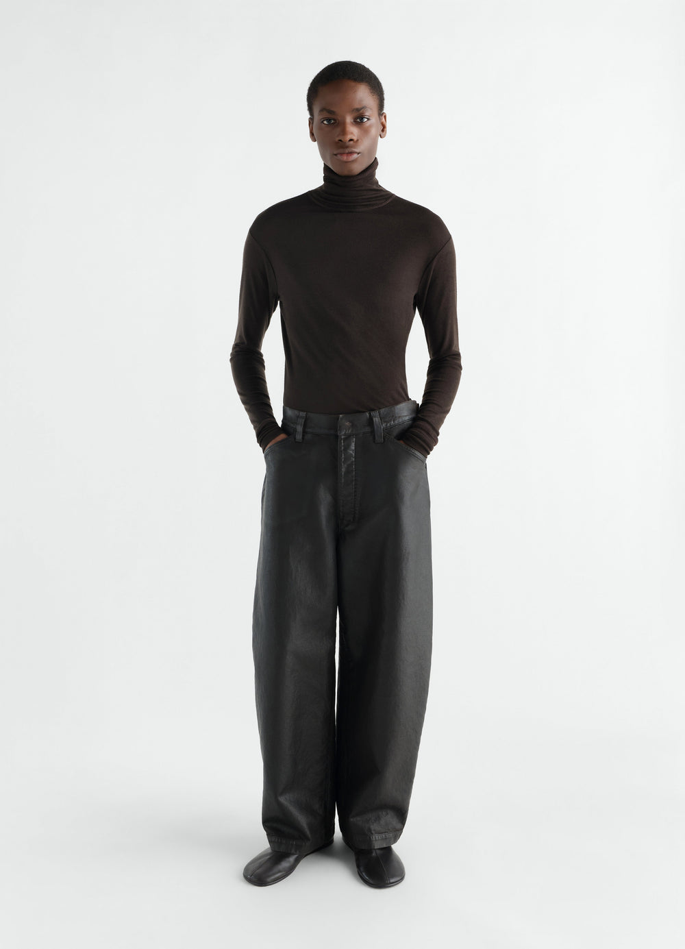 Stand-collar wool and silk jersey top in dark brown worn by model front view LEMAIRE