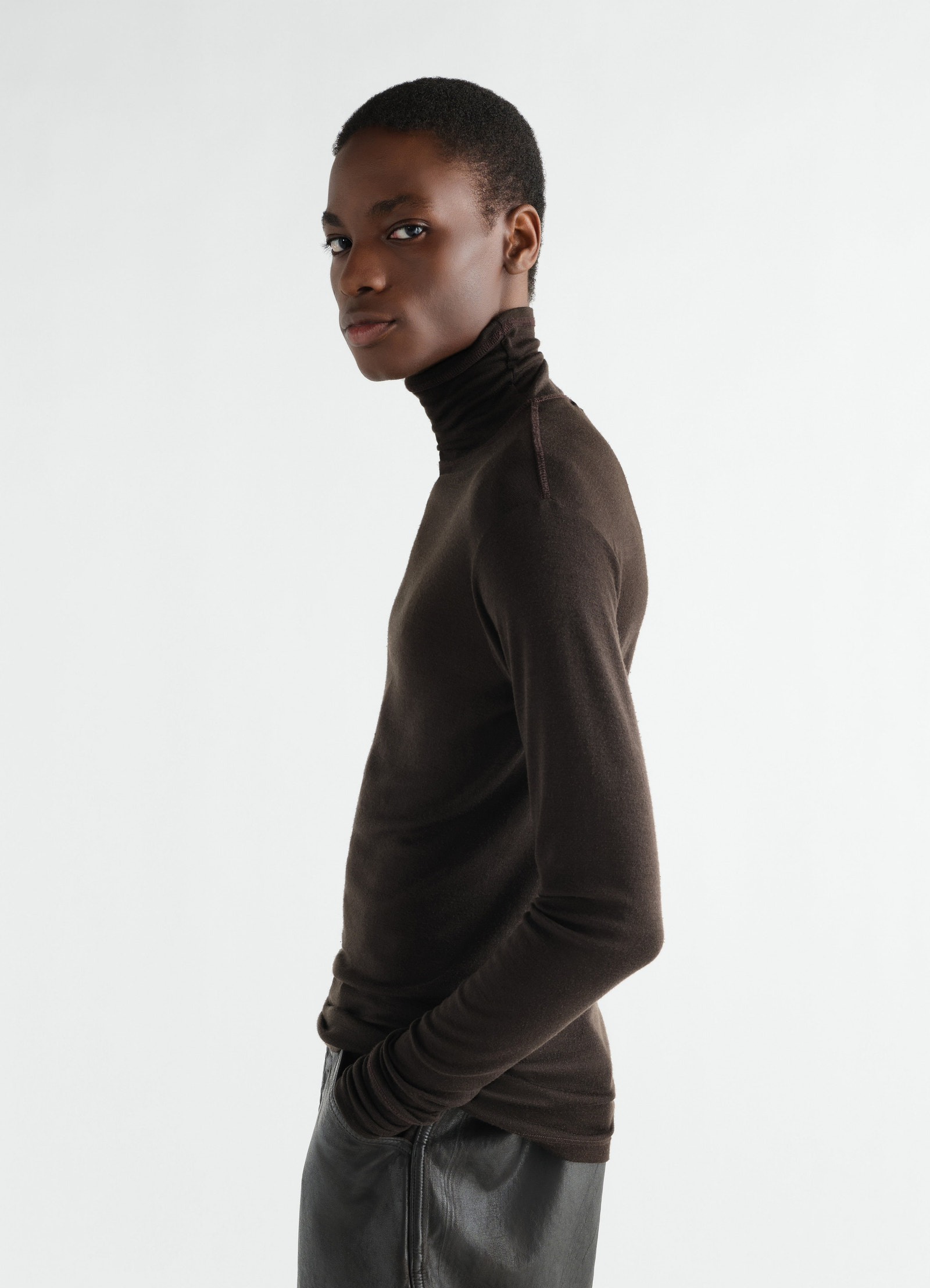 Stand-collar brown wool silk jersey top lemaire worn by model side view with leather trousers