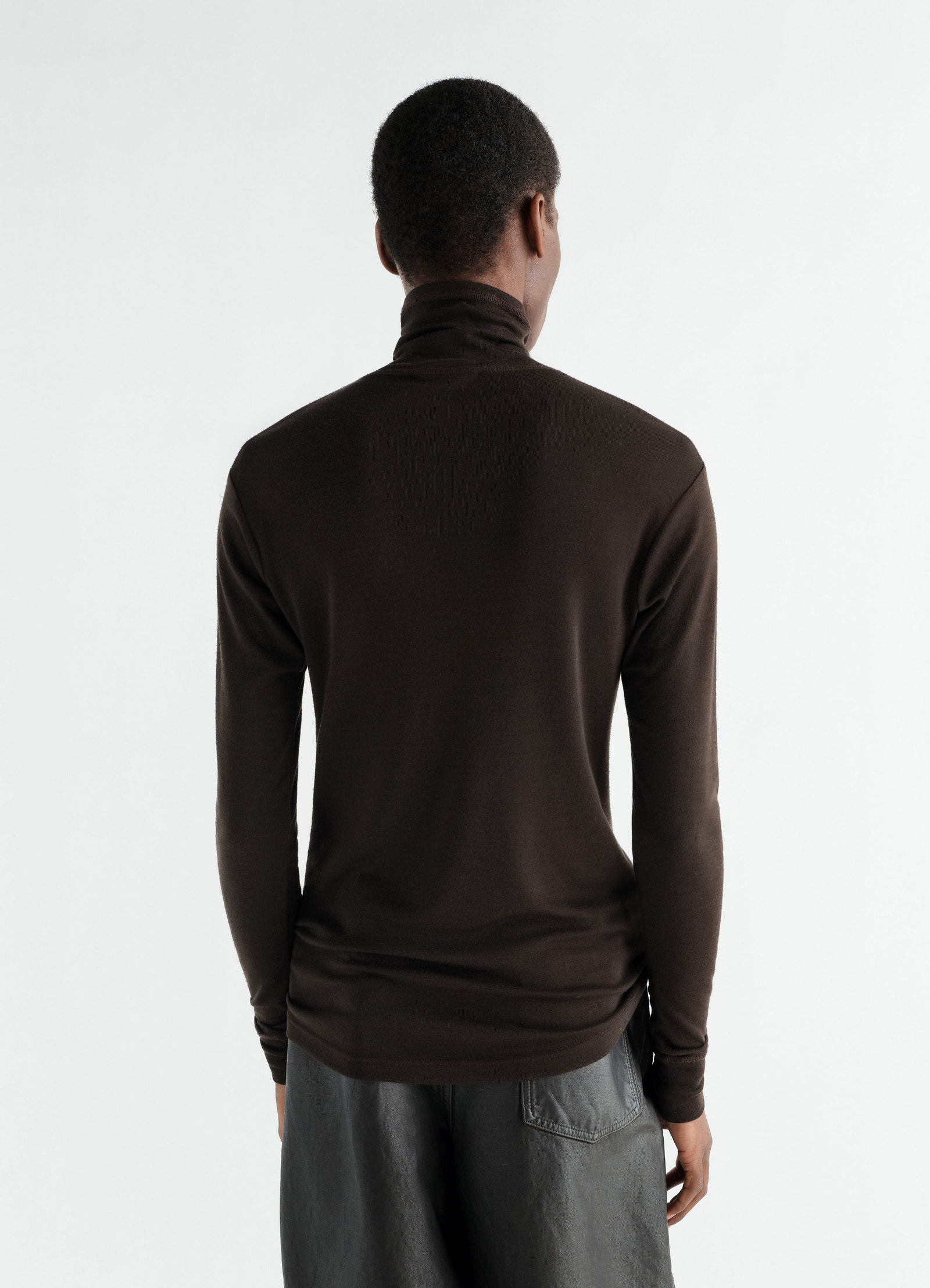 Stand-collar wool and silk jersey top in dark brown by lemaire worn by a model, back view