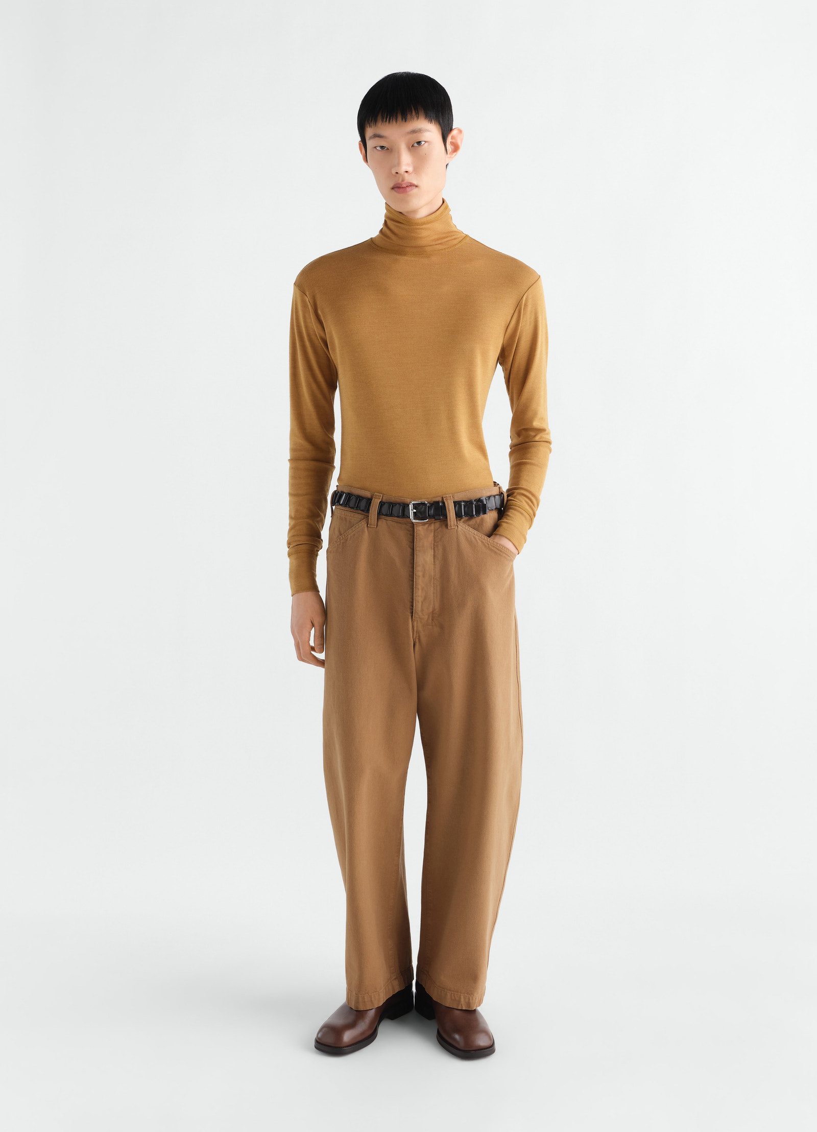 Stand-collar wool and silk jersey top in camel brown by lemaire worn by model front view
