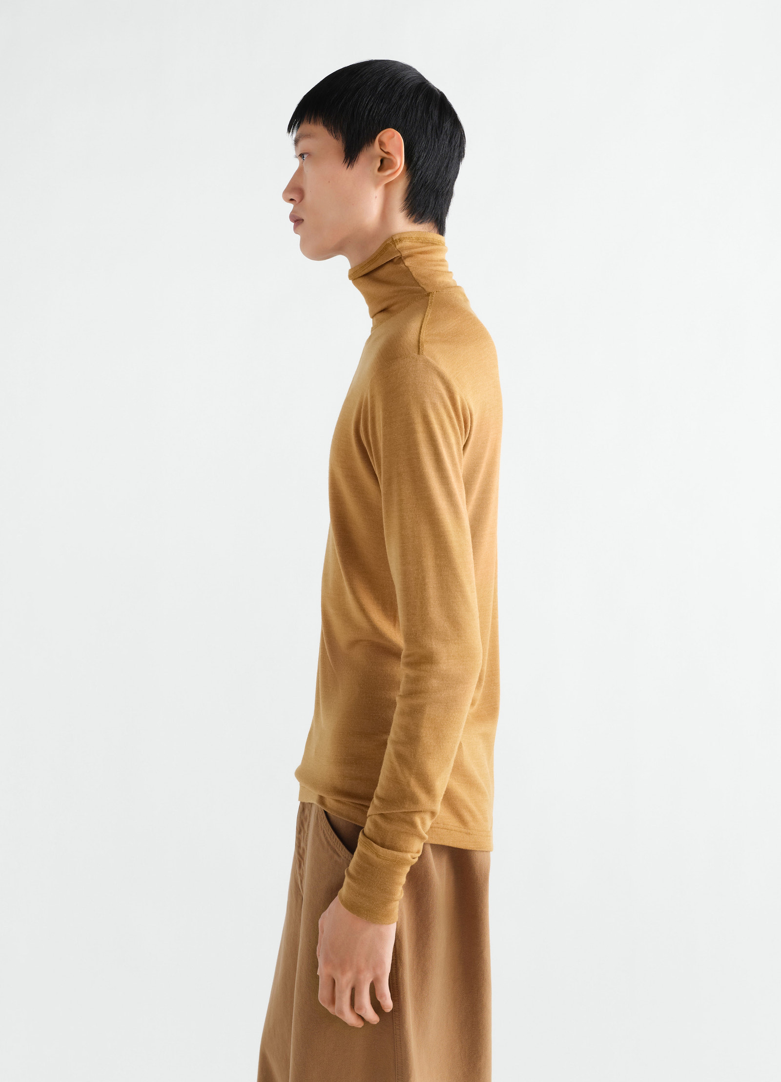 Stand-collar wool and silk jersey top in camel brown by lemaire side view worn by model