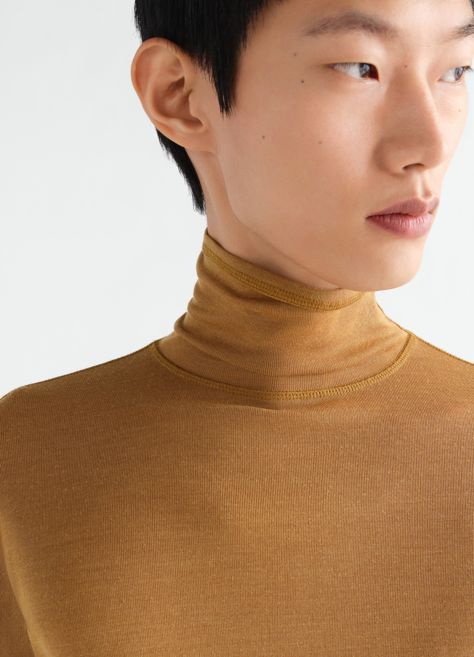 Lemaire stand-collar top in brown wool and silk jersey close-up worn by model