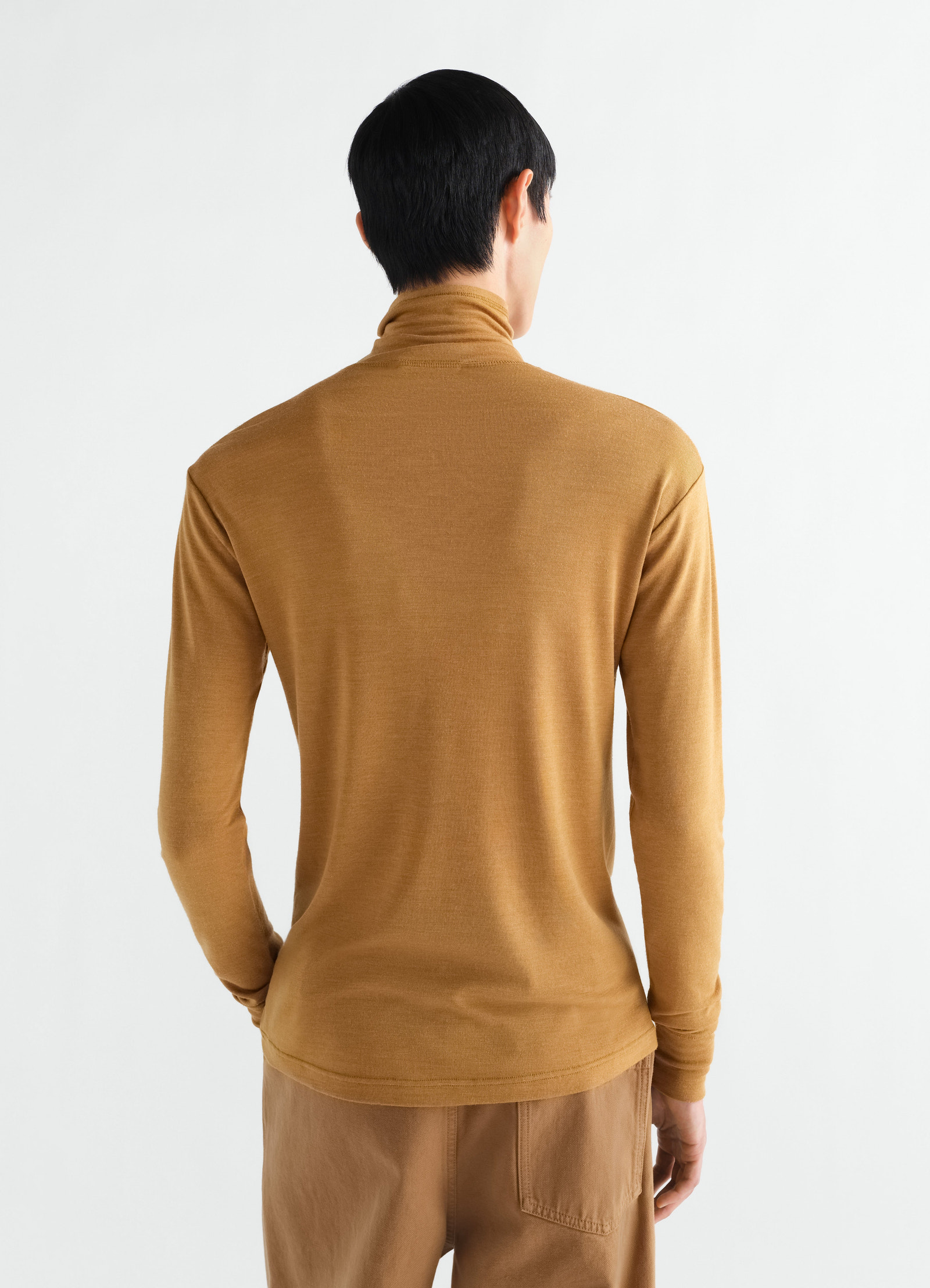 Stand-collar wool and silk jersey top in camel brown by lemaire worn by model back view