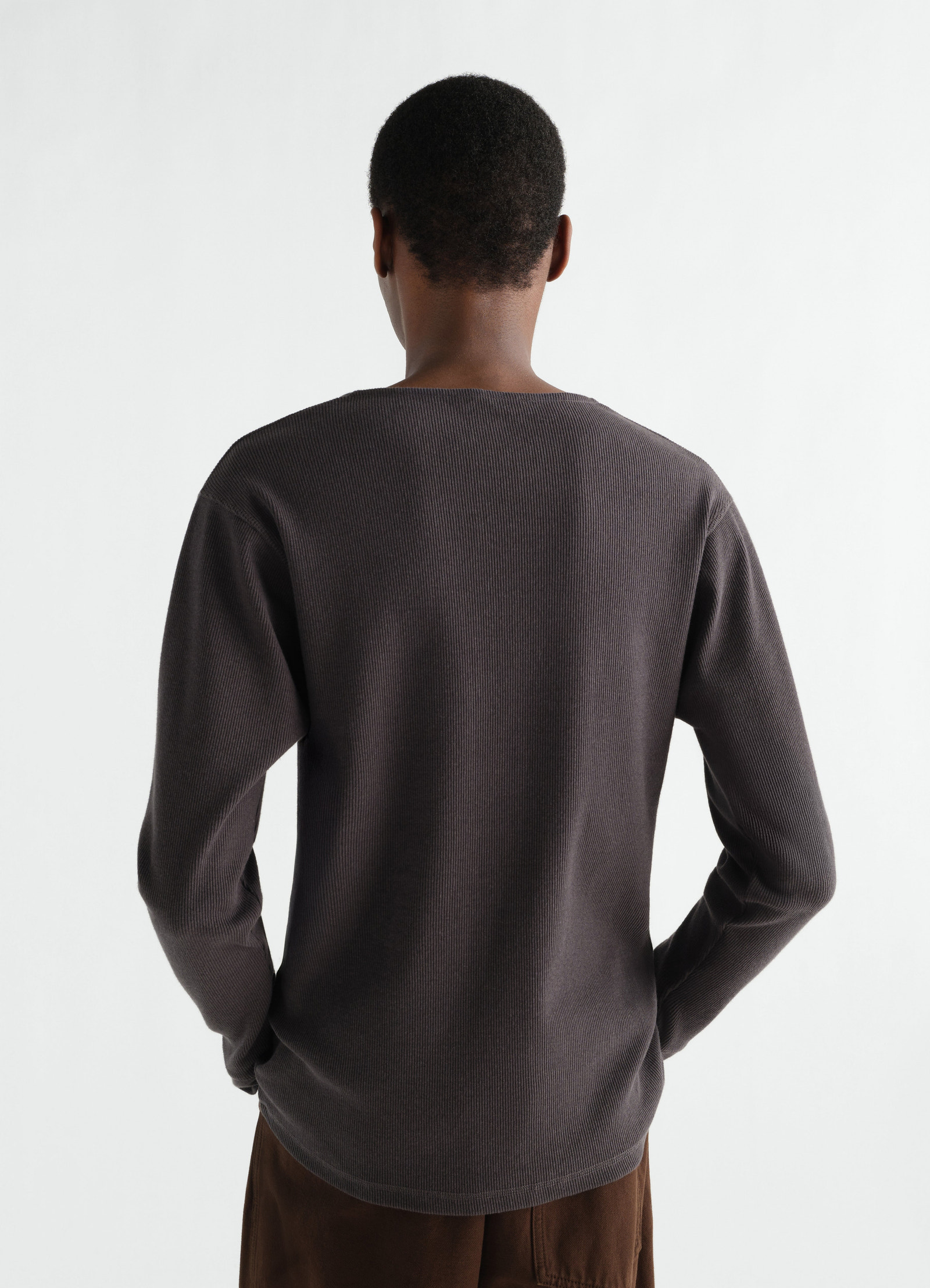 Long-sleeve dark grey linen cotton ribbed jersey henley t-shirt by lemaire worn by model back view