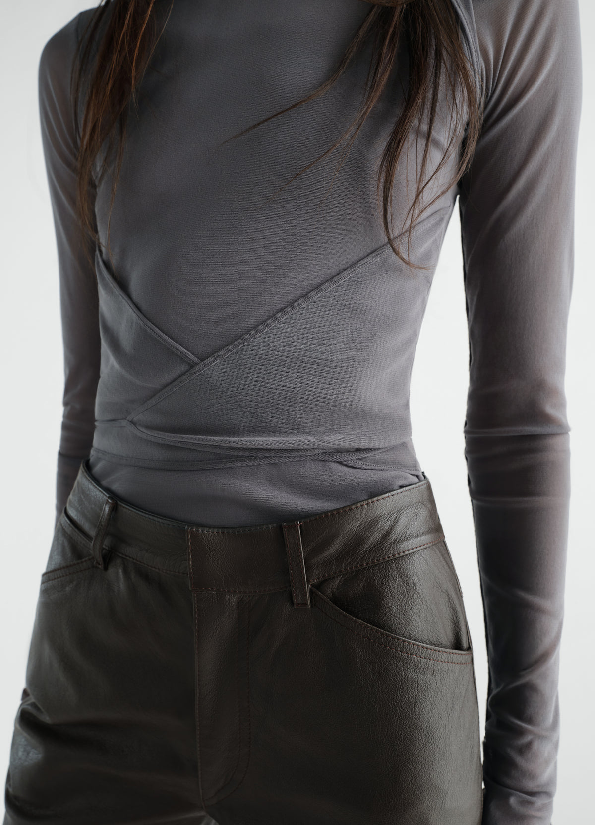 Ballerina wrap top in grey mesh jersey worn by model front view LEMAIRE