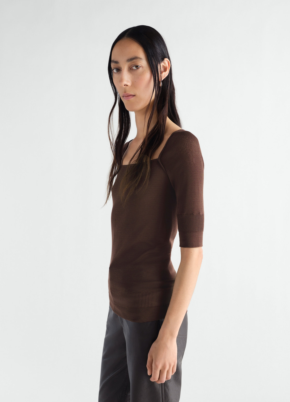 Three-quarter sleeve brown silk-viscose top lemaire worn by a model side view on white background