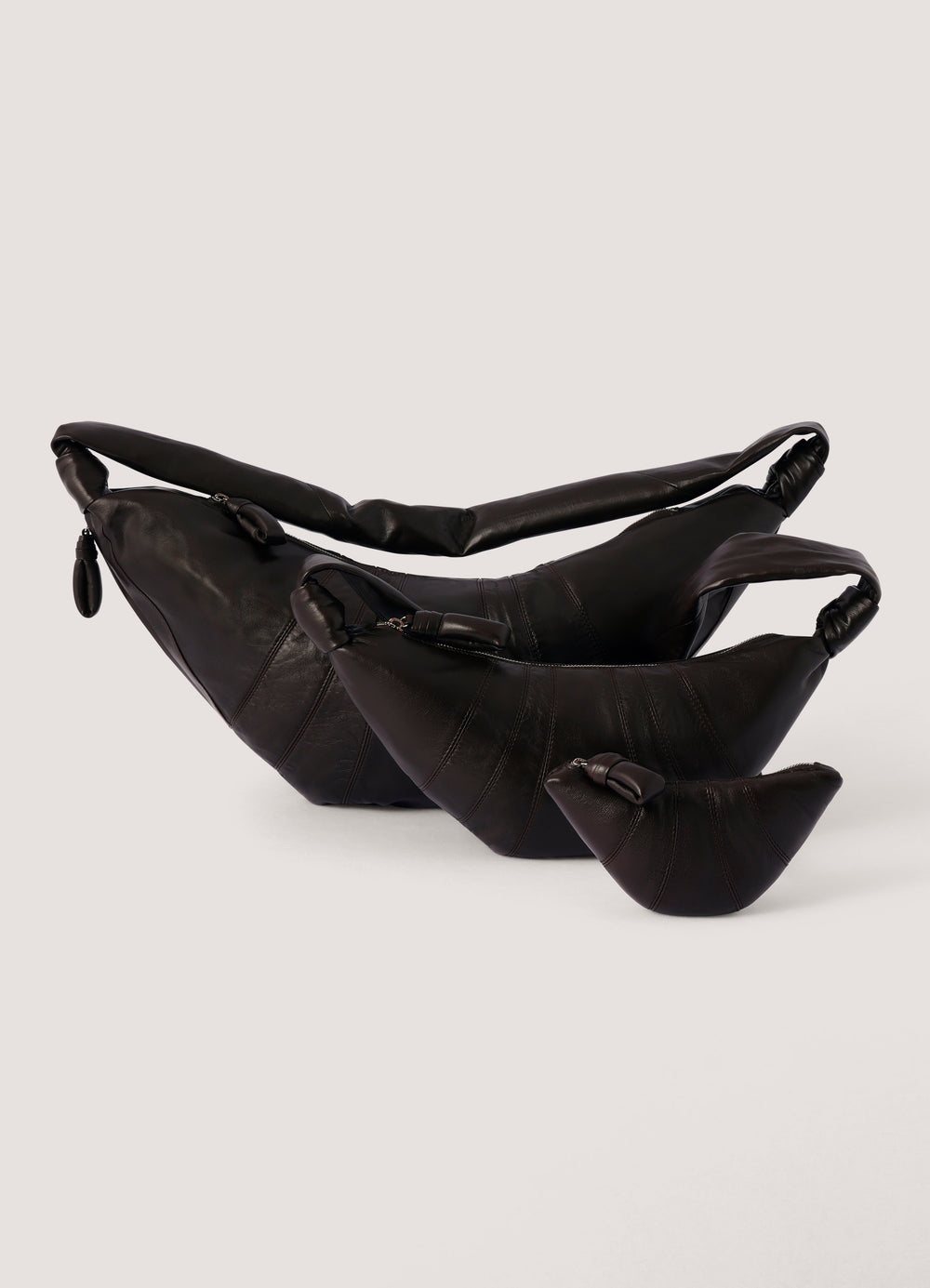 Croissant Coin Purse in Smooth Nappa Leather, product shot, nested group display twisted strap detail