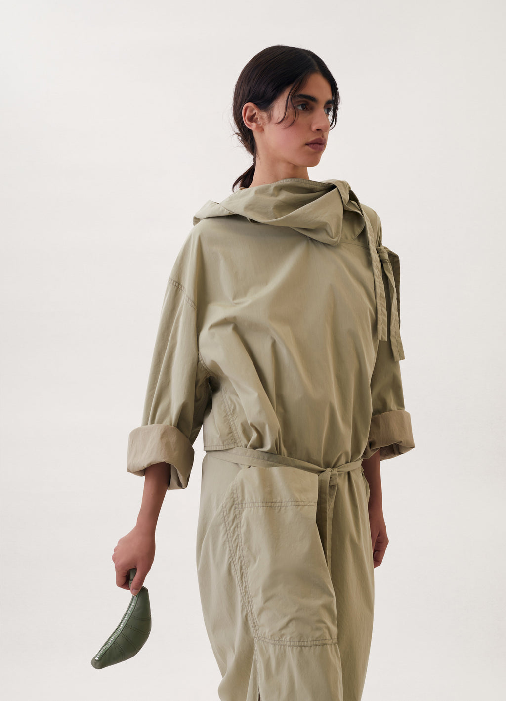 Croissant Coin Purse in Smooth Nappa Leather, model shot, held in hand view soft curved form