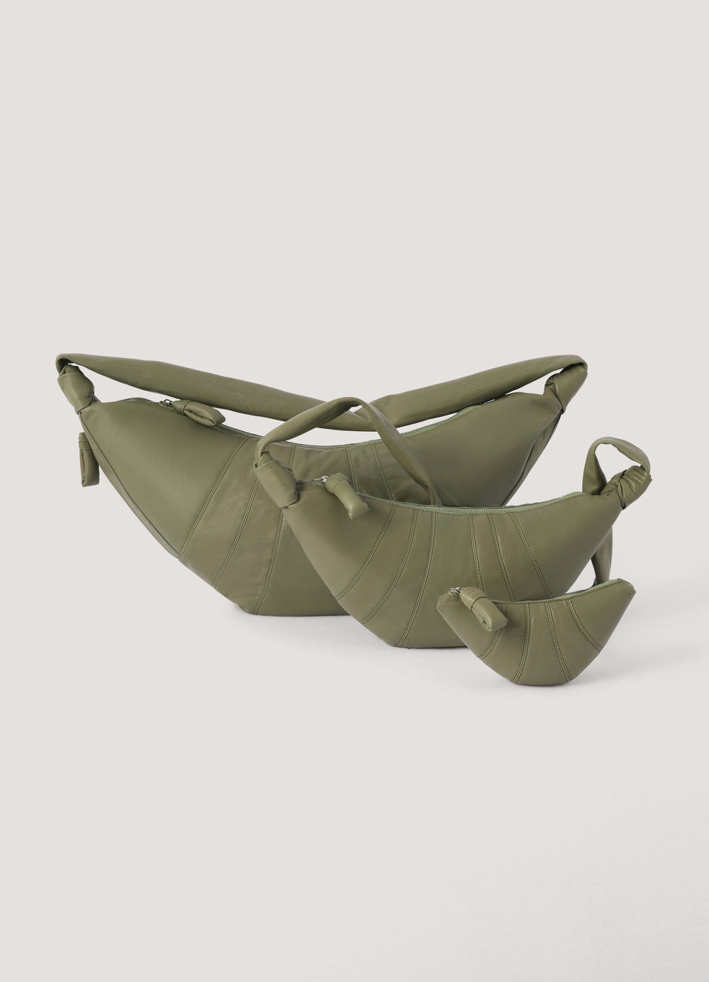 Croissant Coin Purse in Smooth Nappa Leather, product shot, grouped display layered zipper