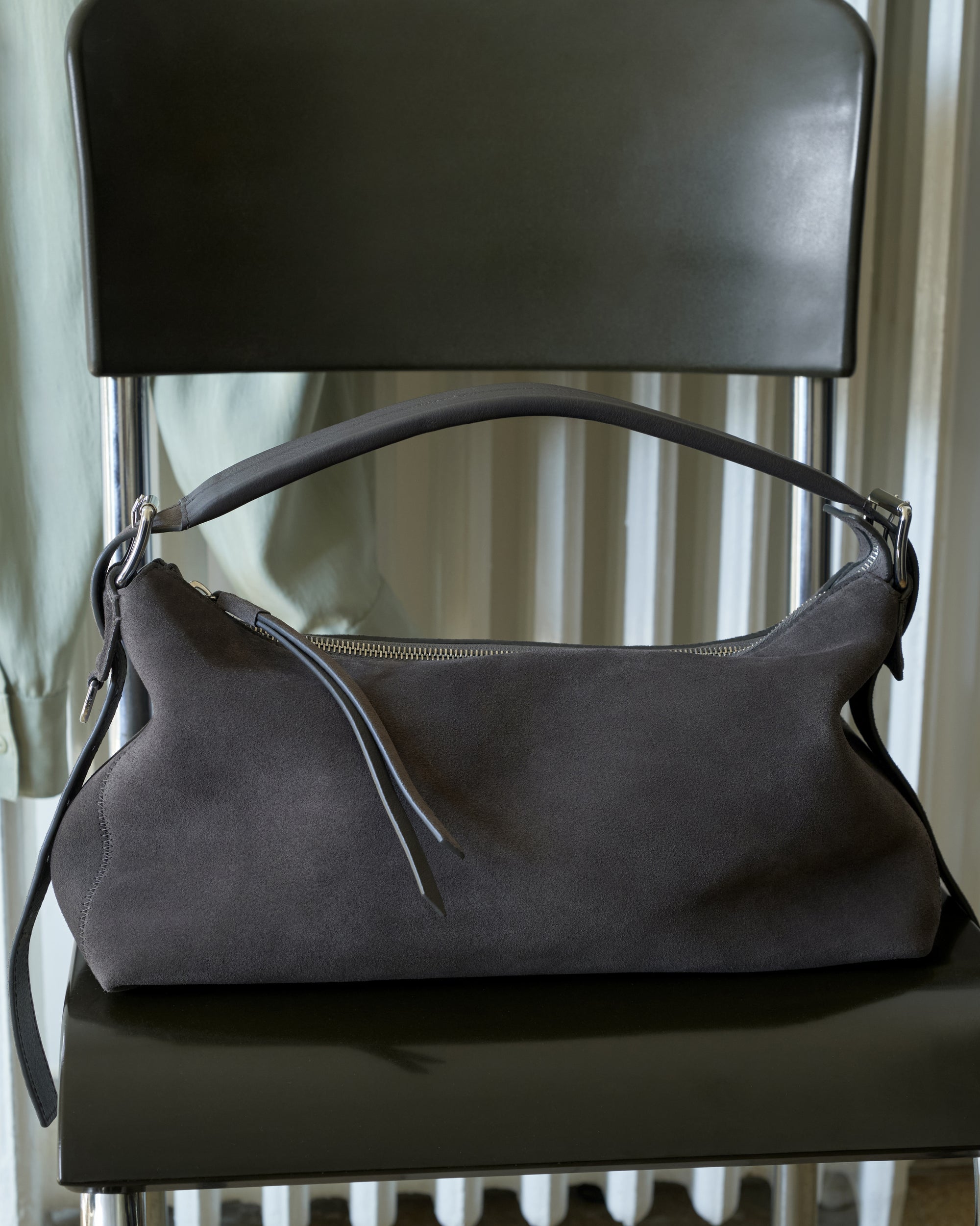 Suede handbag in dark grey suede, product shot, front view minimal design