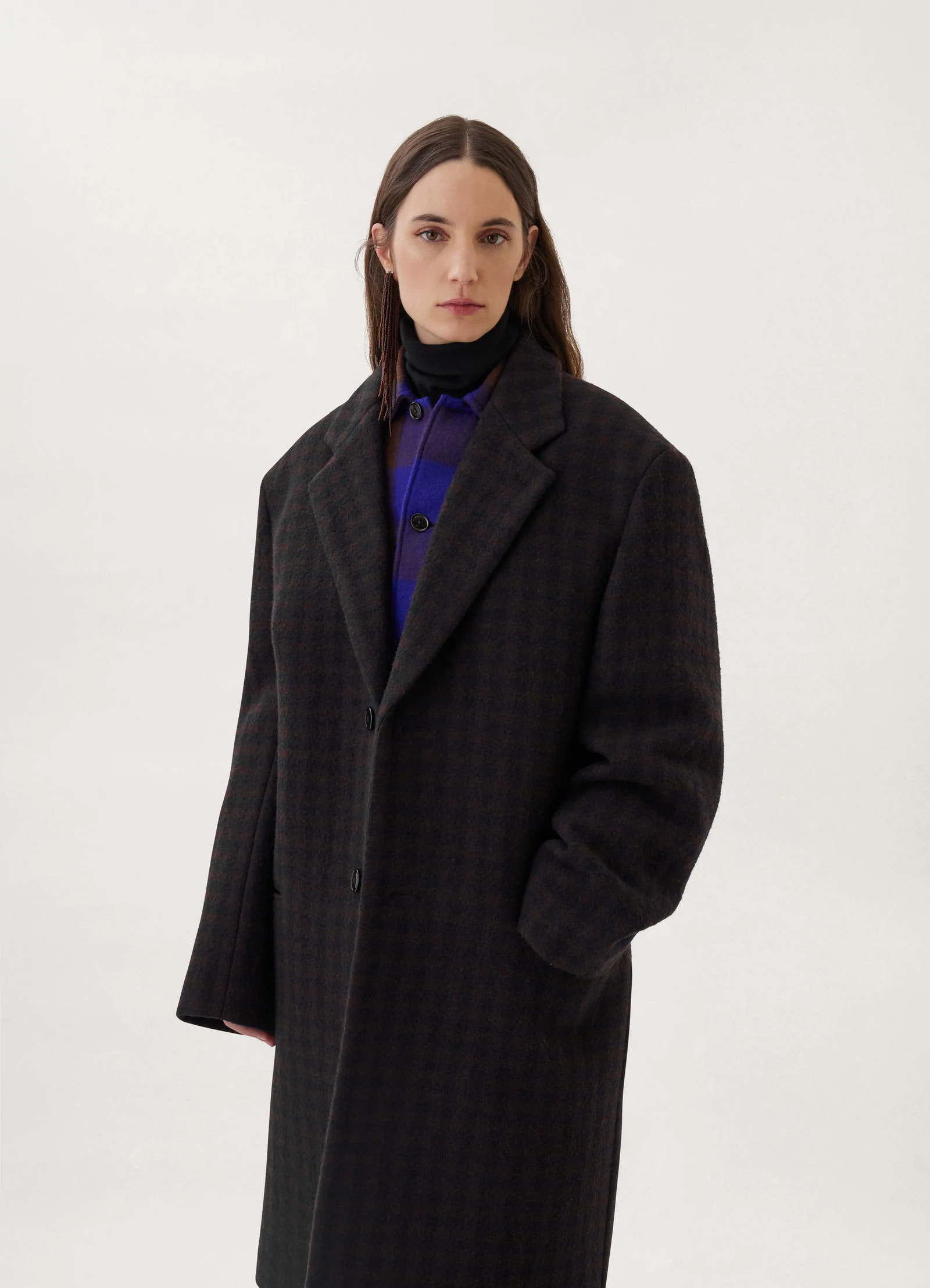 Lemaire chesterfield coat in brown/marine, model shot, close-up view buttoned closure