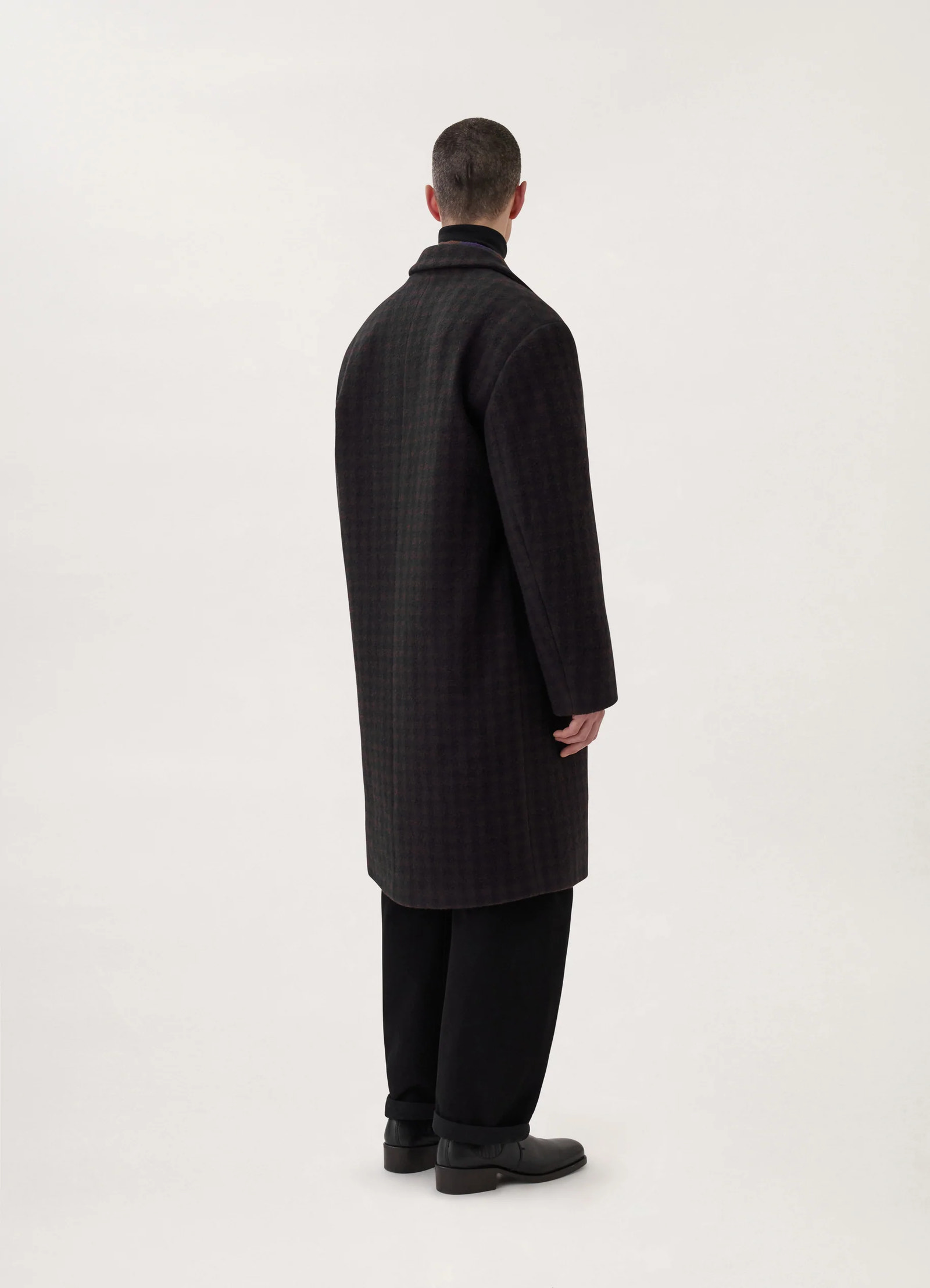 Lemaire chesterfield coat in brown/marine, model shot, back profile view subtle checkered design