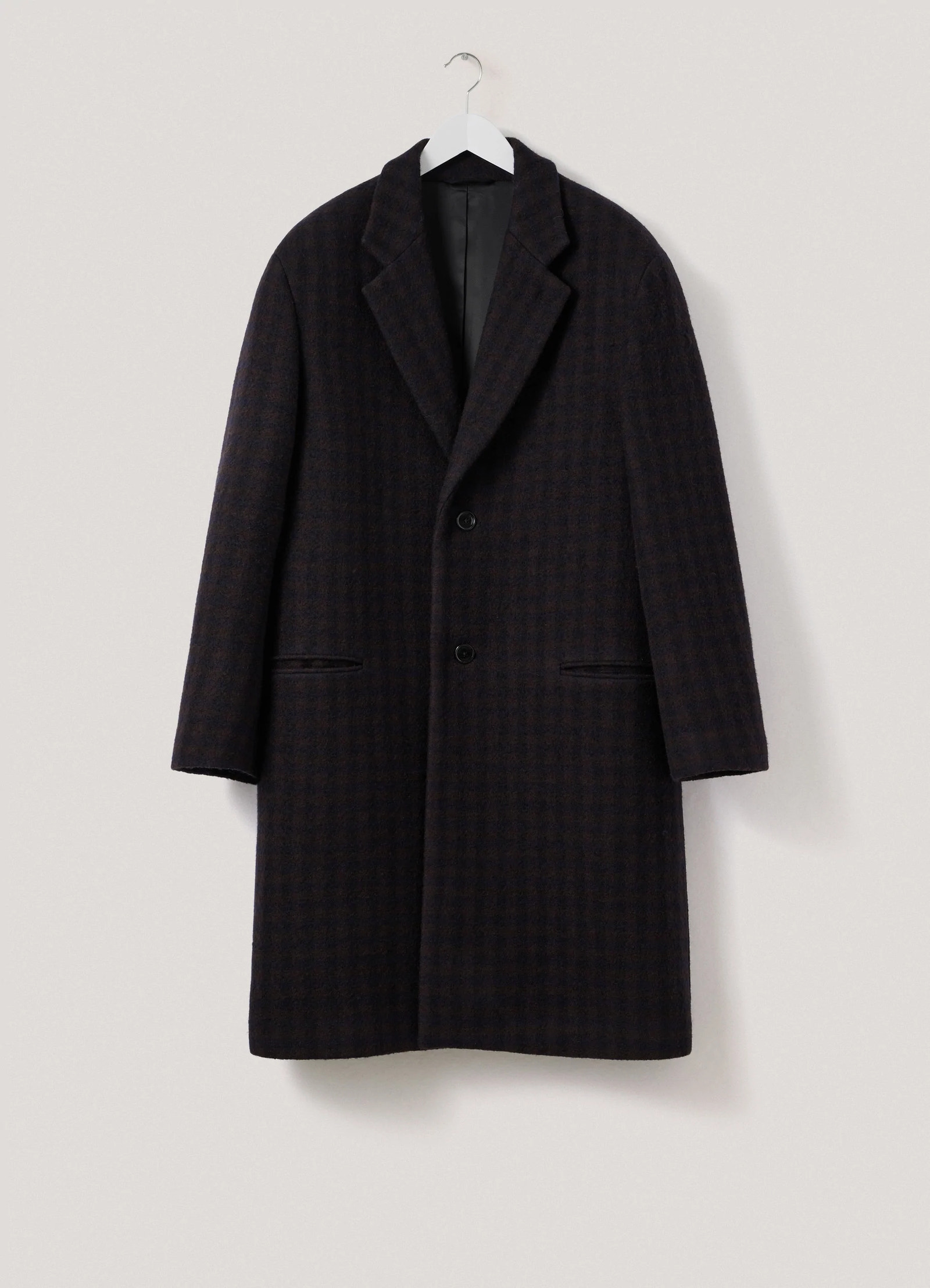 Lemaire chesterfield coat in brown/marine, product shot, hanger view textured pattern, hidden pockets
