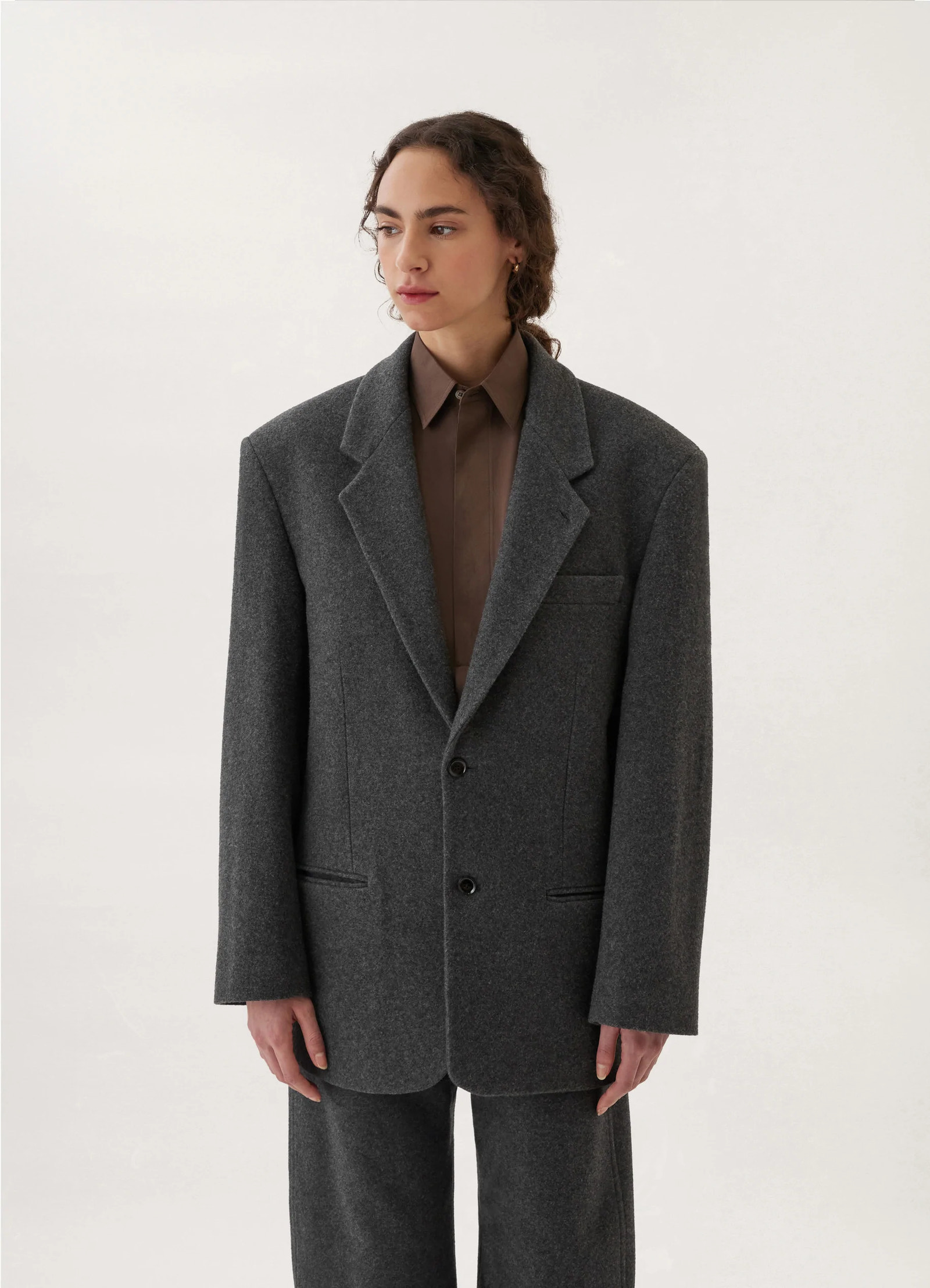 Lemaire boxy single-breasted jacket in felted wool, model shot, front view oversized fit, dual buttons