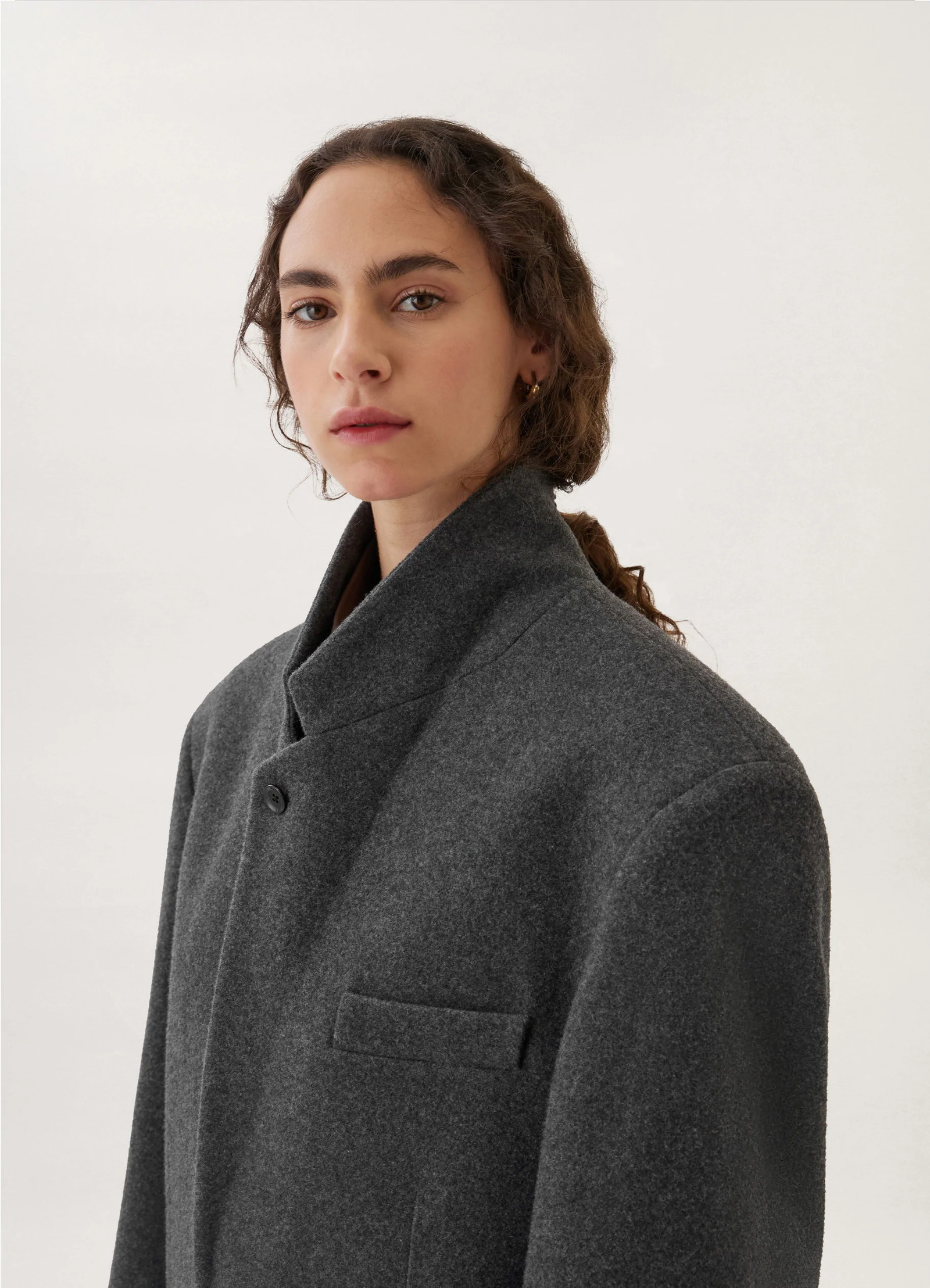Lemaire boxy single-breasted jacket in felted wool, model shot, close-up shot high stance collar