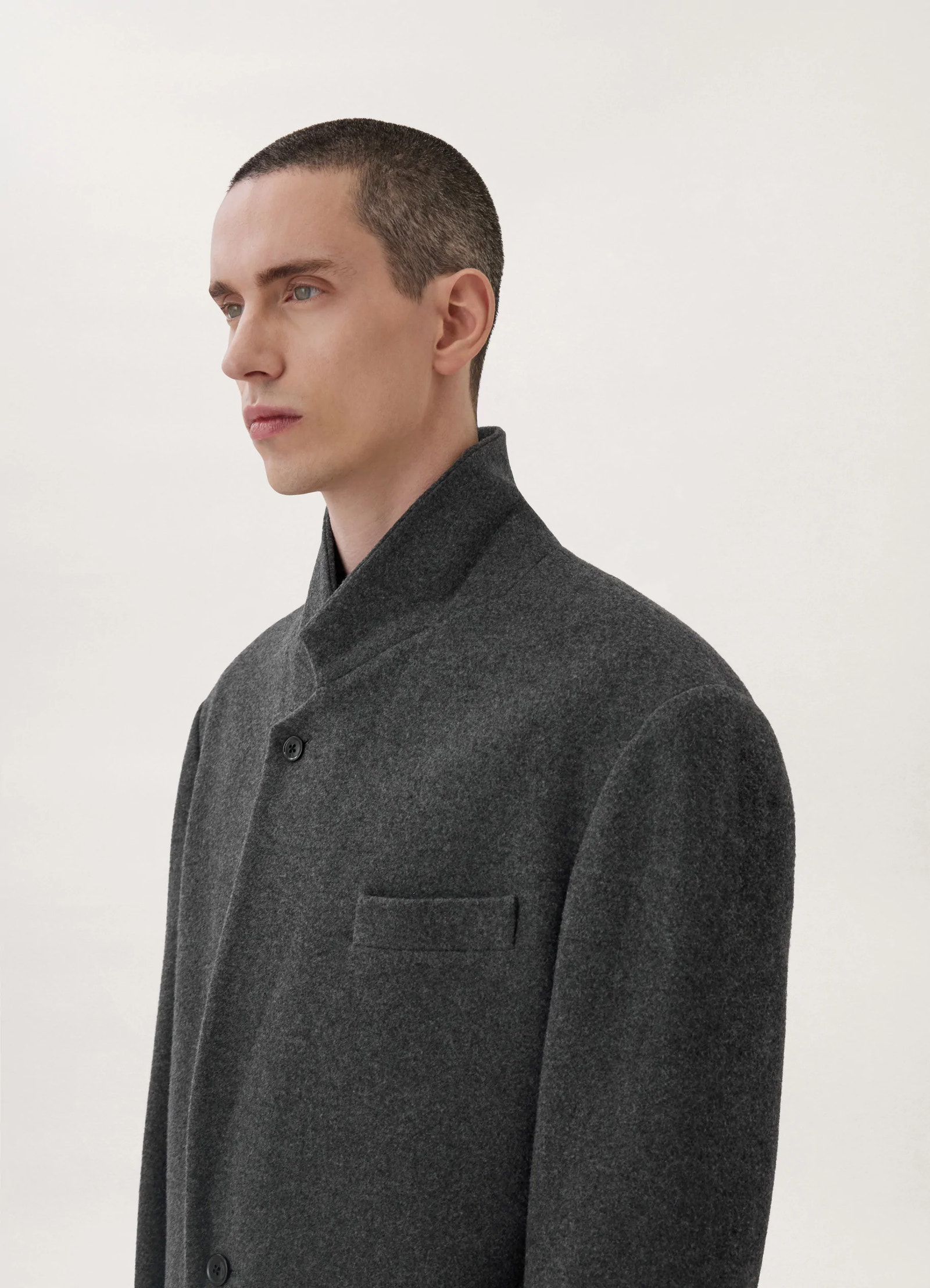 Lemaire boxy single-breasted jacket in felted wool, model shot, close-up profile view high stance collar view 6