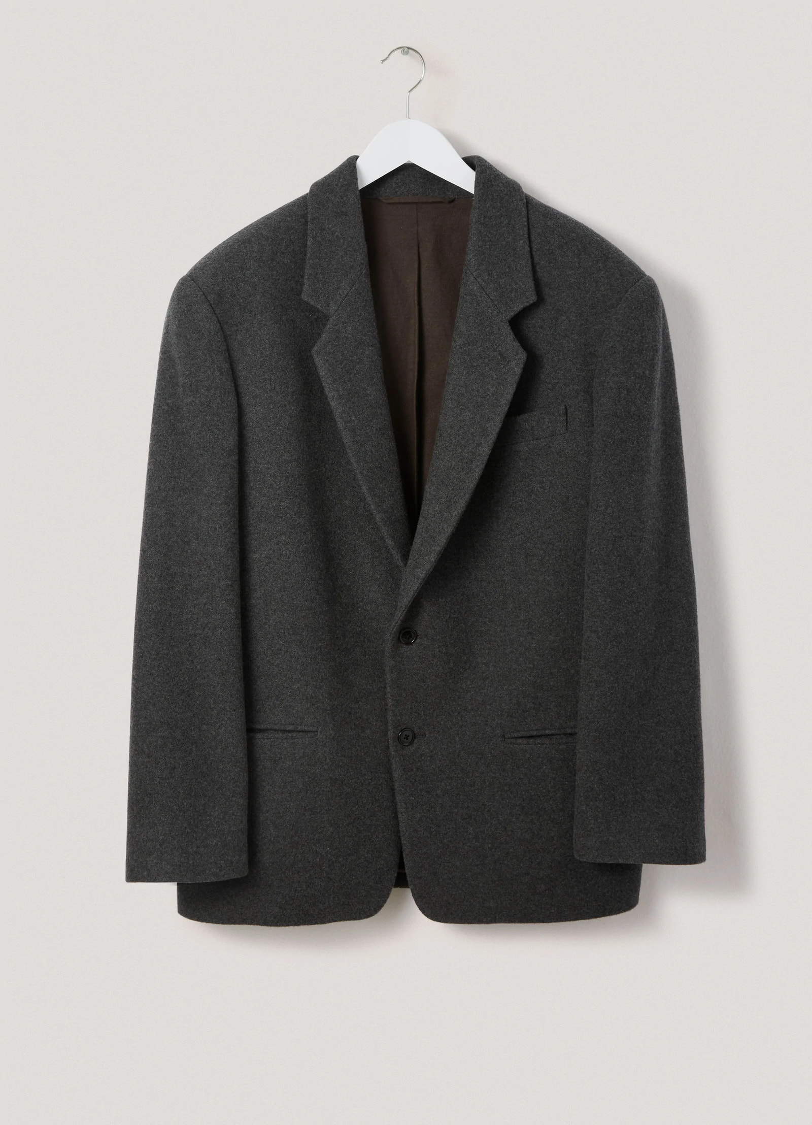 Lemaire boxy single-breasted jacket in felted wool, product shot, hanging frontal view classic notch lapel