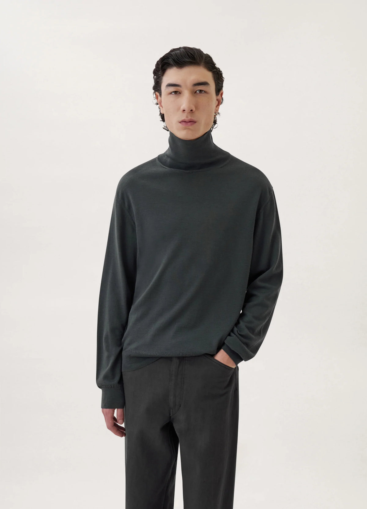 Turtleneck Sweater in Dark Gray Extra-Fine Merino Wool, model shot, Front view Straight-line volume