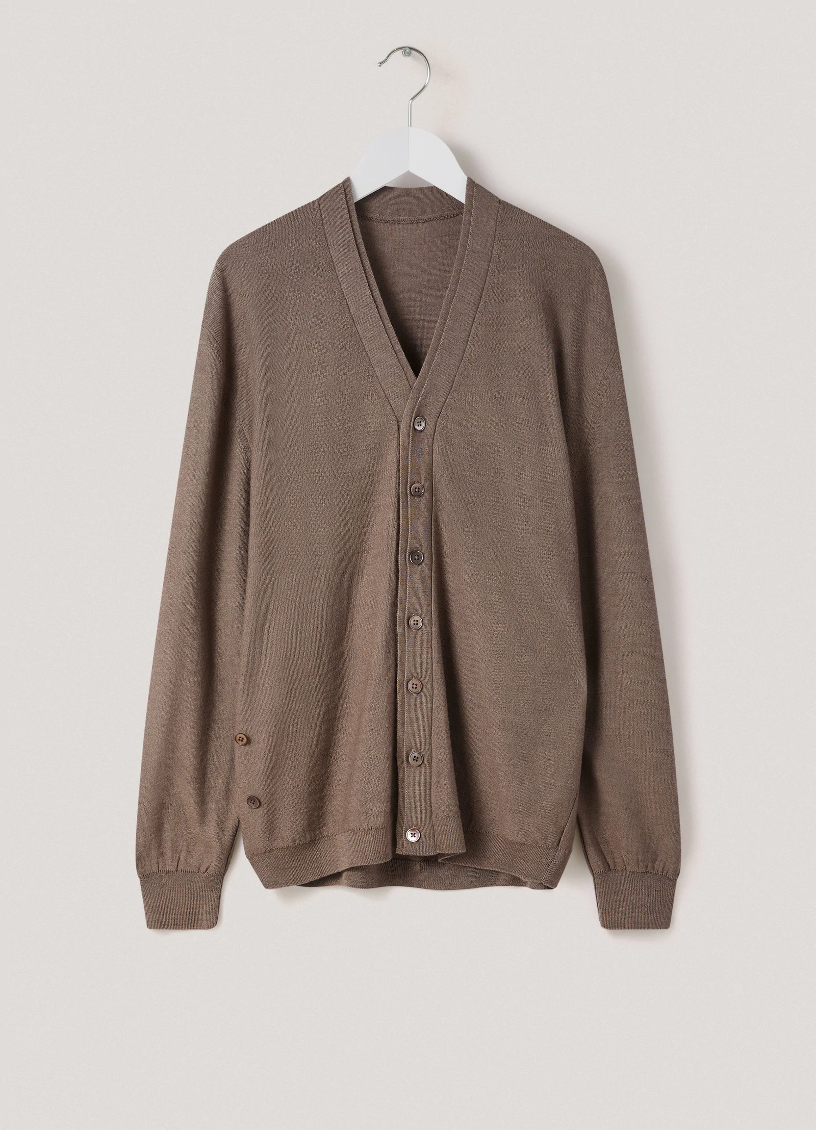Loosely crafted cardigan in heather taupe knit, product shot, hanger drape view ribbed cuffs detail