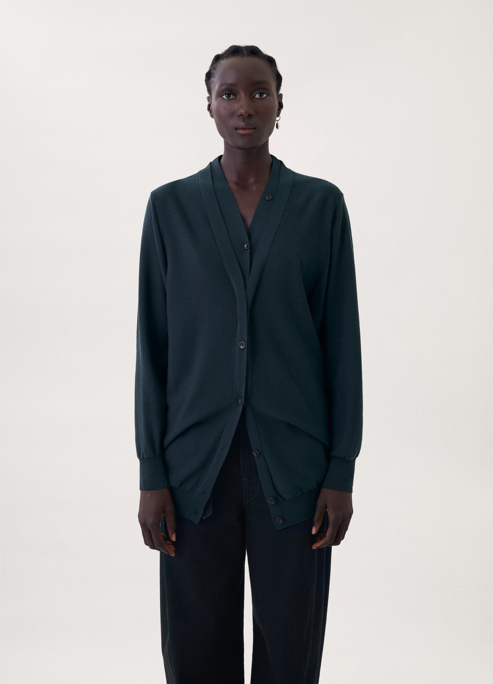 Cardigan with mother-of-pearl in dark green knit, model shot, half-view shawl collar