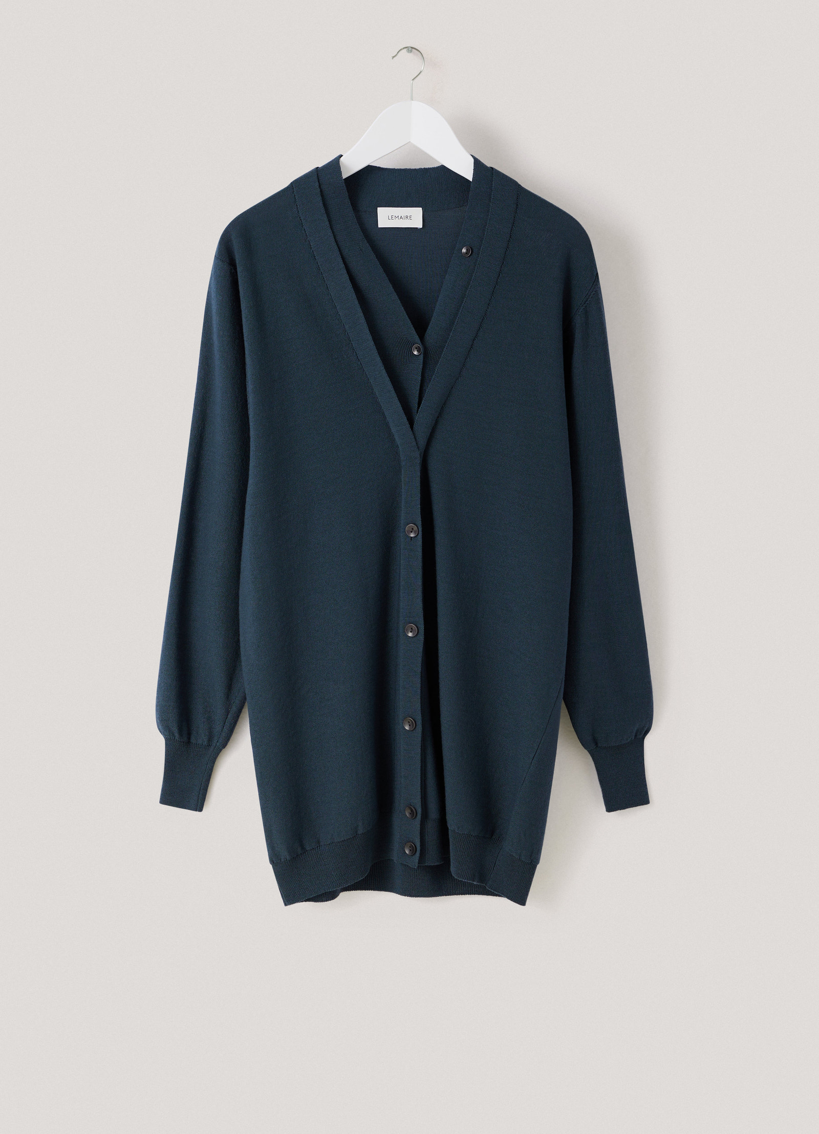 Cardigan with mother-of-pearl in dark green knit, product shot, hanging display view ribbed cuffs and hem